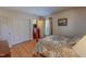 The bedroom features hard wood floors, and a four poster bed at 382 Wimbledon Dr, Roxboro, NC 27573