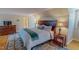 Comfortable bedroom featuring wood floors, a plush rug, and a stately bed at 382 Wimbledon Dr, Roxboro, NC 27573