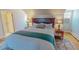 Spacious bedroom featuring hardwood floors, a cozy rug, and a king bed at 382 Wimbledon Dr, Roxboro, NC 27573