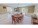 Formal dining room with elegant chandelier and ample seating for Gathering gatherings at 382 Wimbledon Dr, Roxboro, NC 27573