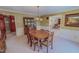 Formal dining room featuring a vintage chandelier, classic wallpaper, and elegant wooden furniture at 382 Wimbledon Dr, Roxboro, NC 27573