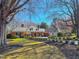 Traditional brick home with mature trees, dormers and meticulously manicured landscaping at 382 Wimbledon Dr, Roxboro, NC 27573