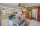 Spacious kitchen and dining area with a kitchen island, ceiling fan, and seamless flow at 382 Wimbledon Dr, Roxboro, NC 27573