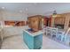Open-concept kitchen with a central island, stainless steel appliances, and a dining area at 382 Wimbledon Dr, Roxboro, NC 27573