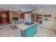 Bright kitchen boasts granite countertops, stainless steel appliances, and a cozy breakfast nook with a fireplace at 382 Wimbledon Dr, Roxboro, NC 27573
