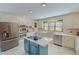 Spacious kitchen boasts stainless appliances, white cabinetry, and a convenient center island at 382 Wimbledon Dr, Roxboro, NC 27573
