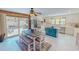 Bright eat-in kitchen with stainless steel appliances, center island and sliding doors to patio at 382 Wimbledon Dr, Roxboro, NC 27573