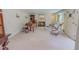 Open living room features a fireplace, a piano, and comfortable seating at 382 Wimbledon Dr, Roxboro, NC 27573
