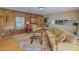Comfortable living room featuring wood paneling, a patterned rug, and classic furnishings at 382 Wimbledon Dr, Roxboro, NC 27573