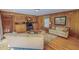 Cozy living room with wood paneling, built-in shelving, and comfortable seating arrangement at 382 Wimbledon Dr, Roxboro, NC 27573