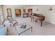 Spacious living room with a piano and beautiful hardwood floors at 382 Wimbledon Dr, Roxboro, NC 27573