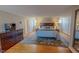 Cozy main bedroom features an area rug on hardwood floor, and a large dresser at 382 Wimbledon Dr, Roxboro, NC 27573