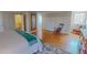 A main bedroom features hardwood floors, a rocking chair, and a large mirror at 382 Wimbledon Dr, Roxboro, NC 27573