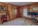 This office offers wood paneled walls, dual monitors, and a comfortable chair at 382 Wimbledon Dr, Roxboro, NC 27573