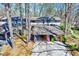 Wide aerial view showcasing the townhome's carport, landscaping, and proximity to neighboring units at 3923 Wendy Ln, Raleigh, NC 27606