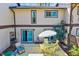 Backyard aerial view of a wooden deck, chairs, table with umbrella at 3923 Wendy Ln, Raleigh, NC 27606