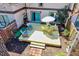 Backyard aerial view of a wooden deck, chairs, table with umbrella at 3923 Wendy Ln, Raleigh, NC 27606