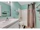 Full bathroom with sink, toilet, tub and shower with curtain at 3923 Wendy Ln, Raleigh, NC 27606
