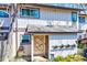 Charming front entrance of this townhome is accentuated with flower boxes and artistic touches at 3923 Wendy Ln, Raleigh, NC 27606