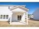 Covered back porch with sliding glass door, offering outdoor relaxation space at 4012 Kingcraig Ln, Zebulon, NC 27597
