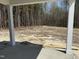 View from the covered patio to the undeveloped backyard at 4012 Kingcraig Ln, Zebulon, NC 27597