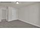 Neutral carpeted bedroom featuring a door to the hall and with a view of the hallway at 4012 Kingcraig Ln, Zebulon, NC 27597