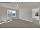 Bright bedroom boasts large windows and neutral carpeting, ready for personalization at 4012 Kingcraig Ln, Zebulon, NC 27597