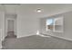 Bright bedroom features large windows providing natural light, carpet floors, and ample space at 4012 Kingcraig Ln, Zebulon, NC 27597