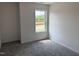 This bedroom has plush carpeting, fresh paint, and a window at 4012 Kingcraig Ln, Zebulon, NC 27597