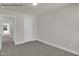 Neutral carpeted bedroom featuring a door to the hall and the bathroom at 4012 Kingcraig Ln, Zebulon, NC 27597