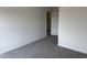 Bedroom featuring neutral carpeting and a doorway that provides entry and natural light at 4012 Kingcraig Ln, Zebulon, NC 27597