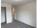 Comfortable bedroom with neutral carpet, closet, and ample space at 4012 Kingcraig Ln, Zebulon, NC 27597