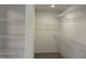 Walk-in closet with multiple levels of wire shelving to maximize storage space in a minimalist design at 4012 Kingcraig Ln, Zebulon, NC 27597