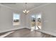 Dining room with sliding glass doors and chandelier at 4012 Kingcraig Ln, Zebulon, NC 27597