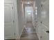 View down a hallway with white trim and doors at 4012 Kingcraig Ln, Zebulon, NC 27597