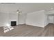 Bright living room with a modern fireplace and wood-look flooring at 4012 Kingcraig Ln, Zebulon, NC 27597