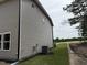 The home's exterior, showing the home's siding and newly laid grass and mulch at 4012 Kingcraig Ln, Zebulon, NC 27597