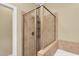 Luxurious bathroom showcasing a glass walk-in shower with tile surround at 402 Womble Dr, Lillington, NC 27546
