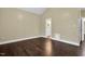 Spacious bedroom with hardwood floors and a view of the bathroom at 402 Womble Dr, Lillington, NC 27546