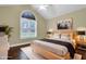 Well-lit bedroom with a large window and a comfortable king-size bed at 402 Womble Dr, Lillington, NC 27546