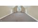 Large bonus room featuring neutral carpeting and lots of natural light at 402 Womble Dr, Lillington, NC 27546