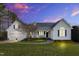 Charming home with a welcoming front porch and well-manicured lawn, perfect for outdoor relaxation at 402 Womble Dr, Lillington, NC 27546