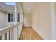 Inviting front porch with sturdy railing and ample space, providing a perfect spot to enjoy the outdoors at 402 Womble Dr, Lillington, NC 27546