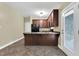 Features of the kitchen include granite countertops, tile floor, and stainless steel appliances at 402 Womble Dr, Lillington, NC 27546