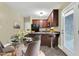Eat-in kitchen with granite countertops and stainless steel appliances and a glass table at 402 Womble Dr, Lillington, NC 27546