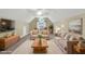 Comfortable living room with vaulted ceilings and natural lighting at 402 Womble Dr, Lillington, NC 27546