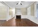 Bright living room showcasing hardwood floors and a fireplace at 402 Womble Dr, Lillington, NC 27546