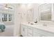 Bathroom featuring double sinks with white cabinetry and tile flooring at 405 Daisy Grove Ln, Holly Springs, NC 27540