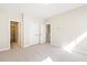 Spacious carpeted bedroom with ensuite bathroom and walk-in closet at 405 Daisy Grove Ln, Holly Springs, NC 27540