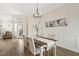Inviting dining room with neutral tones, natural light, and seamless flow into the living area, perfect for entertaining at 405 Daisy Grove Ln, Holly Springs, NC 27540